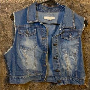 Denim jean jacket with cut-off frayed sleeves